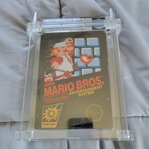NES Super Mario Bros WATA 7.0 1st edition 1987.  Hangtab.  No TM on front NES.